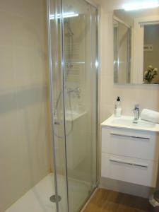 a bathroom with a shower and a sink at Apartamentos LA PEREDA SANTANDER in Santander