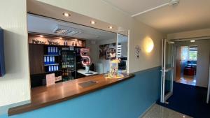 a display case in a store with a mirror at Motel 44 in Geseke