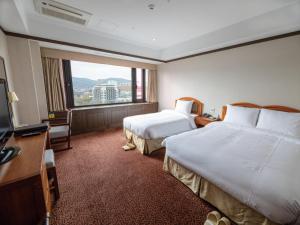 Postel nebo postele na pokoji v ubytování The K Hotel Gyeongju + 37 fotografií