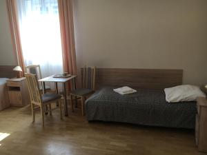 Posteľ alebo postele v izbe v ubytovaní Stary Dom Zdrojowy