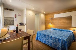Postel nebo postele na pokoji v ubytování Camping Internazionale Etruria