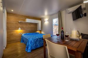 Postel nebo postele na pokoji v ubytování Camping Internazionale Etruria