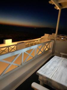 a view from a balcony of a train station at Vrachia Studios & Apartments in Oia