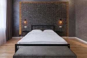 Posteľ alebo postele v izbe v ubytovaní LEOGRAND Three Bedrooms VIP Apartments on Kniazia Romana 12