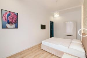 Posteľ alebo postele v izbe v ubytovaní LEOGRAND Three Bedrooms VIP Apartments on Kniazia Romana 12