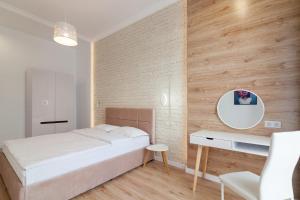 Posteľ alebo postele v izbe v ubytovaní LEOGRAND Three Bedrooms VIP Apartments on Kniazia Romana 12