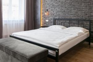 Posteľ alebo postele v izbe v ubytovaní LEOGRAND Three Bedrooms VIP Apartments on Kniazia Romana 12
