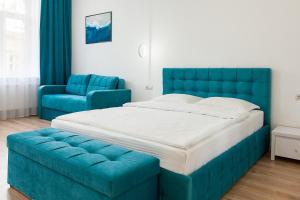 Posteľ alebo postele v izbe v ubytovaní LEOGRAND Three Bedrooms VIP Apartments on Kniazia Romana 12