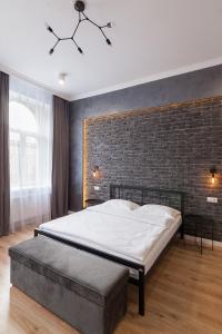 Posteľ alebo postele v izbe v ubytovaní LEOGRAND Three Bedrooms VIP Apartments on Kniazia Romana 12