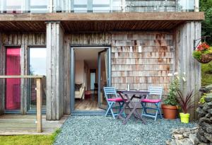 a wooden house with a table and chairs at Dome House in Bowness-on-Windermere