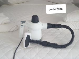 a black and white controller sitting on top of a bed at Vrahos in Kardamaina