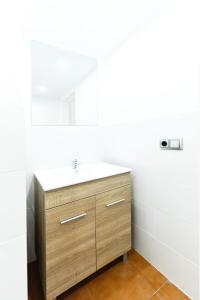 a bathroom with a sink and a mirror at Design Club Reus in Reus