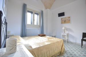 A bed or beds in a room at Lu Trisciulu