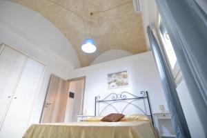 A bed or beds in a room at Lu Trisciulu