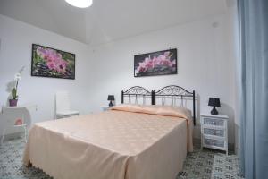 A bed or beds in a room at Lu Trisciulu