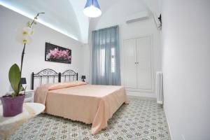 A bed or beds in a room at Lu Trisciulu