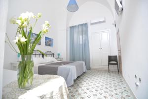 A bed or beds in a room at Lu Trisciulu