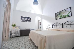 A bed or beds in a room at Lu Trisciulu