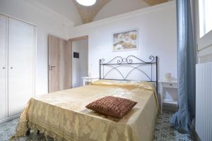 A bed or beds in a room at Lu Trisciulu