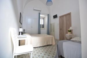 A bed or beds in a room at Lu Trisciulu