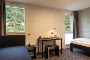 B&B Hotel Mattli Übernachtung Frühstück客房内的一张或多张床位