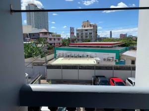 a view from a window of a building with a parking lot at Prontip Place in Godown