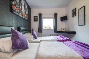 
a bedroom with a large bed and a large window at Peterborough by Verve in Peterborough
