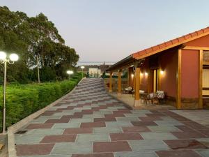 a long walkway with a building and street lights at Apartamentos La Arena in Miengo