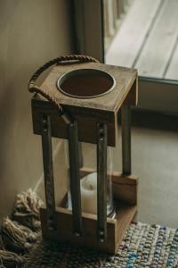 a wooden bird house sitting on top of a table at Santa Barbara Eco-Beach Resort in Ribeira Grande