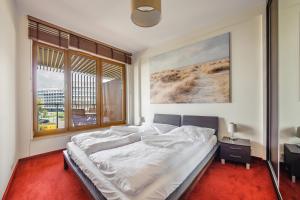 
Łóżko lub łóżka w pokoju w obiekcie Apartamenty Sun & Snow Olympic

