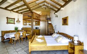 a bedroom with a bed and a table and chairs at Villa Lenka and Mate Ivanac in Brela