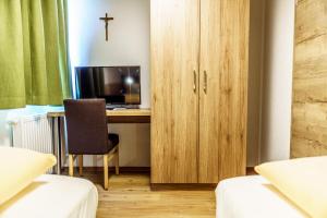 Televízia a/alebo spoločenská miestnosť v ubytovaní Haus Löger Apartments Pyhrn Priel