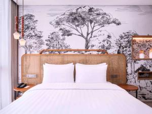 Postelja oz. postelje v sobi nastanitve Mercure Tangerang BSD City