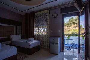 Ένα ή περισσότερα κρεβάτια σε δωμάτιο στο Hotel Jibal Chaouen