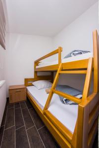 a room with two bunk beds in it at Rooms Hercegovka in Čapljina