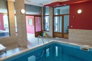 a large swimming pool in a hotel room at Hotel Uzunski in Smolyan