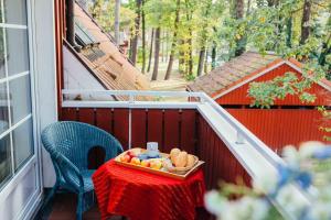 a tray of fruit on a table on a balcony at Ferienwohnung Strandperle in Prerow