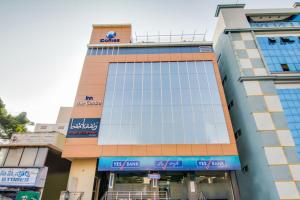 a building with a clock on top of it at INN THE CENTRE in Nellore