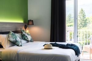 Postel nebo postele na pokoji v ubytování Hôtel du Pont