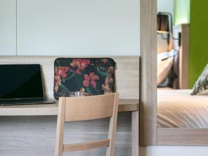 Postel nebo postele na pokoji v ubytování Hôtel du Pont