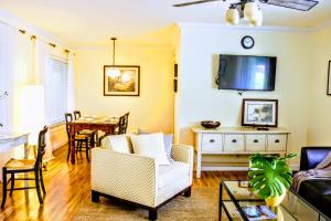 a living room with a couch and a table at Villa Venezia in Fort Lauderdale