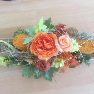 a bouquet of flowers on a wooden table at Hotel Angermeier GARNI in Eching