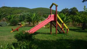 a group of playground equipment in a park at Agriturismo Isidoro in Fertilia