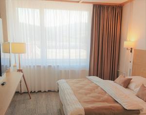 Hotel Adamantino客房内的一张或多张床位