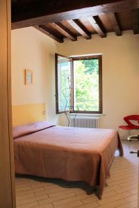 Postel nebo postele na pokoji v ubytování La casa di Alice