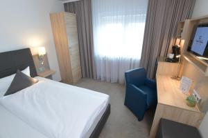 Postel nebo postele na pokoji v ubytování Hotel Krone