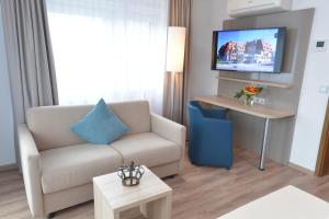 TV a/nebo společenská místnost v ubytování Hotel Krone
