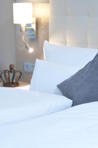 Postel nebo postele na pokoji v ubytování Hotel Krone