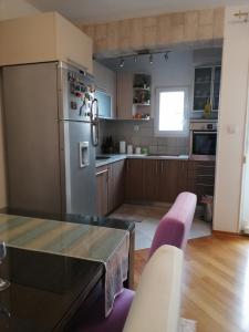 Кухня или мини-кухня в Apartment Visoka
