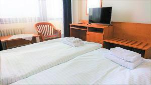 Hotel Adamantino客房内的一张或多张床位